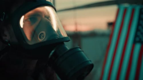 Woman with Gas Mask Standing near American Flag