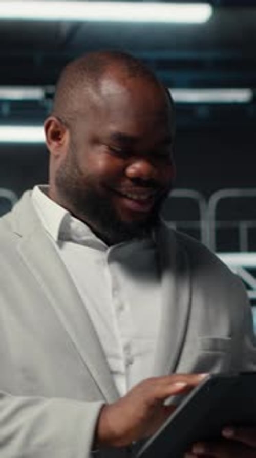 Vertical Video System Administrator Walking in Server Farm Deploying Infrastructure