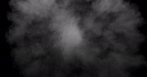 Smoke fills the space from the center of the frame on a black background.