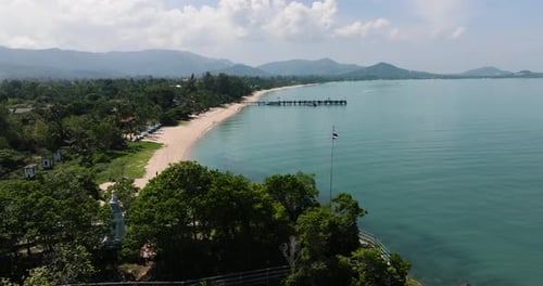 Sandy Beach with Pier and Distant Hills Ko Samui Thailand