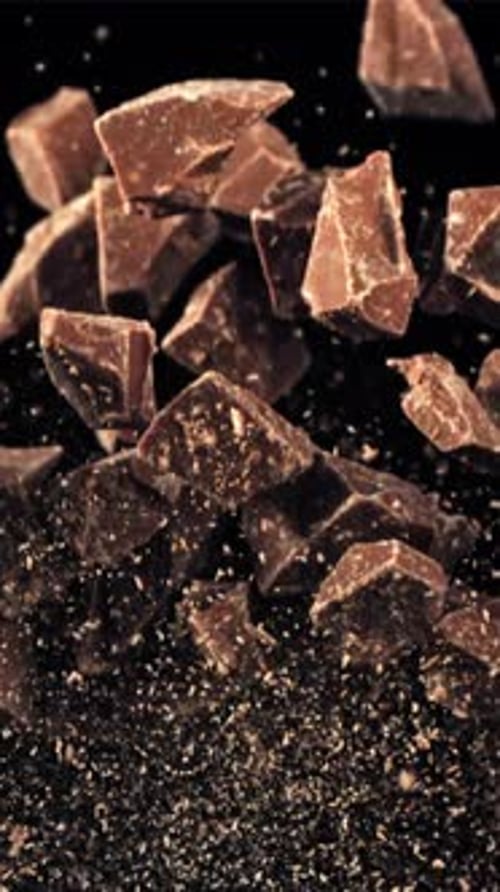 Chunks of Chocolate Fly Up and Fall Down Filmed on a Highspeed Camera at 1000 Fps