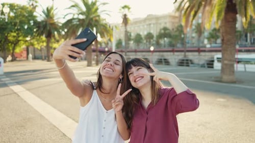 Two Women Taking Selfie in Urban Setting