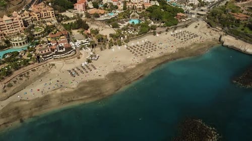 Beautiful Scene At Seaside With Beach and Blue Sea At Seashore Buildings Drone Shot