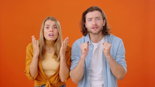 Excited Young Adults Cheering and Celebrating Victory