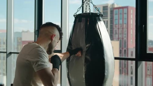 Back View Muscular Caucasian Sportsman Fighter Boxer Hitting Punching Bag Box Workout Active