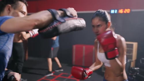 Sporty Coach Training Athlete woman Boxing exercise