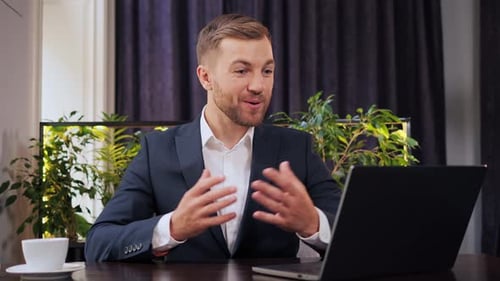 Handsome Energetic Optimistic Business Man Talking to Web Cam Laptop Video Call