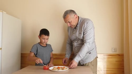 Family Cooking Together with Caviar in Kitchen