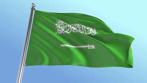Waving Flag of Saudi Arabia Against Blue Sky