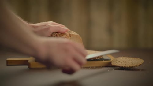 Fresh Bread Sliced on a Cutting Board