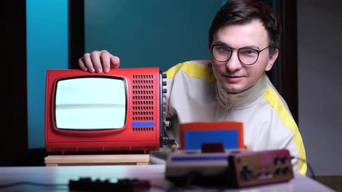 Man Posing with Retro Video Gaming Setup