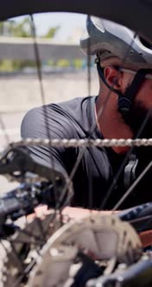Repair, sports and black man with bicycle in city for fitness, training