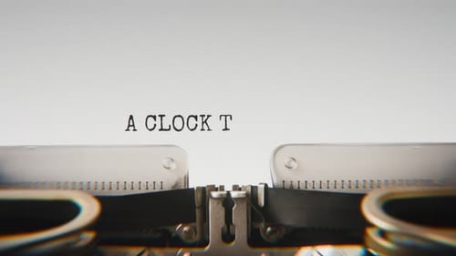 Old mechanical typewriter typing A Clock Ticked In The Darkness in a close-up view.