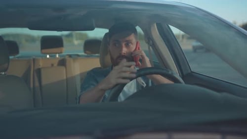 Frustrated Man Arguing on Phone in Car
