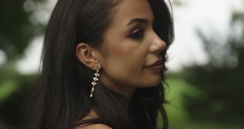 Close up portrait of a young woman with black hair and red lips