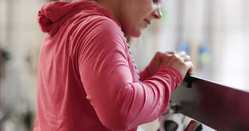 Craftsperson working in snowboard workshop