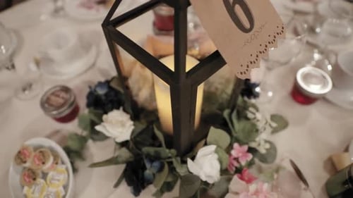 Beautifully set reception table with a lantern bouquet center piece at Strathmere weddings and event