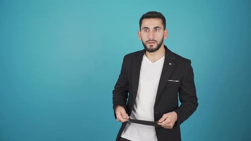 Man Puts on Mask and Gives Thumbs Up