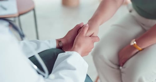 Doctor, hands and comfort patient in hospital after cancer diagnosis, death or grief