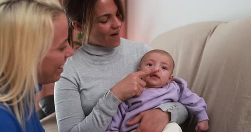 Women with an Adorable Infant at Home