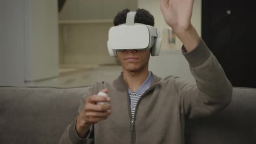 Young Adult Using VR Headset and Controller
