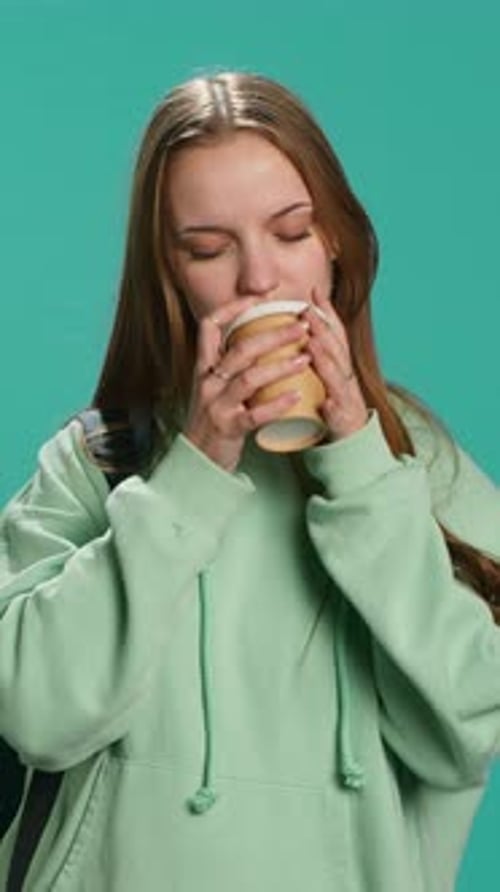 Vertical Video Young Girl Yawning Feeling Tired Drinking Coffee to Wake Up