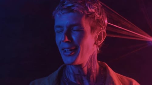 Man Dancing Under Colorful Laser Lights