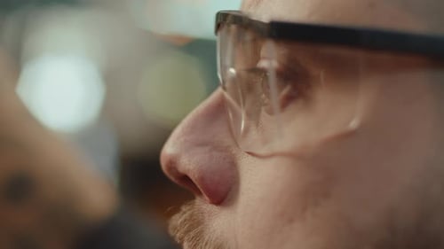 Mechanic in Safety Glasses Working in Garage