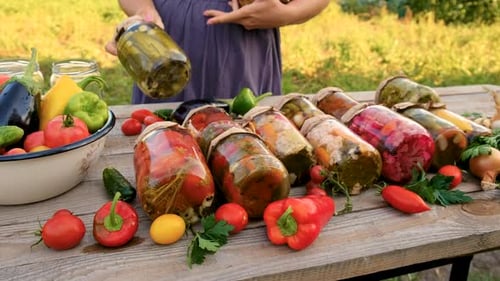 Preservation of Vegetables in Jars Woman Selective Focus