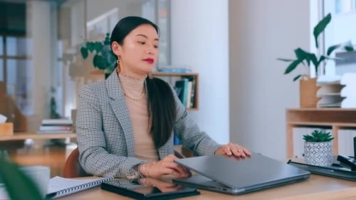 Business Woman Closing Laptop in Office Environment