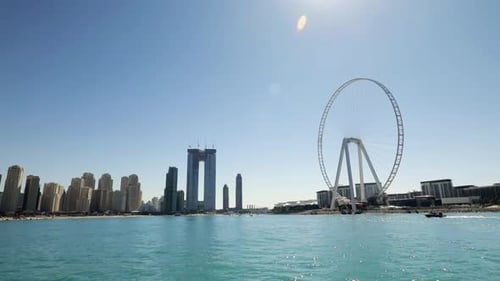 Wide View Of Dubai Marina Towers And Ferris Wheel From The Sea
