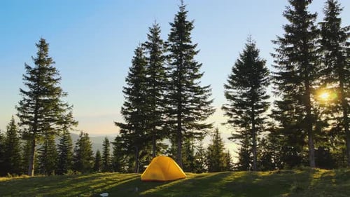 Aerial View of Tourist Camping Tent on Mountain Campsite at Bright Sunny Evening