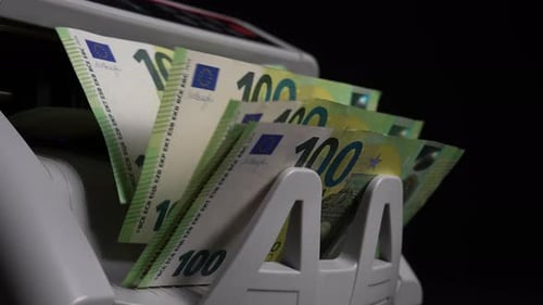 Euro Banknotes being Counted by Machine