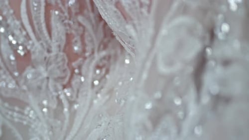 Extreme Close-Up of Elegant White Lace with Shimmering Sequins