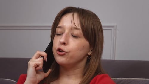 Woman Talking on Phone Indoors