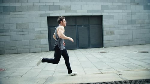 Fitness Man Running on Urban Street in . Male Runner Jogging