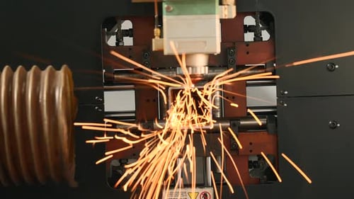 CNC Machine Cutting Metal with Sparks Flying