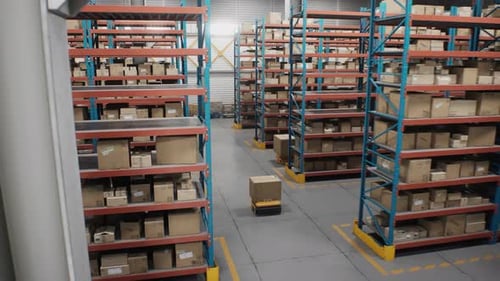 Logistics Distribution Center Automated Guided Vehicles Transporting Cardboard Boxes