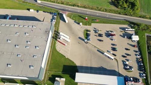 Aerial view of goods warehouse. Logistics center in industrial city zone from above. Aerial view of