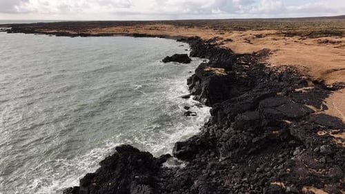 Aerial view of rugged volcanic coastline near Búðakirkja, Búðir, Snæfellsnes Peninsula, Iceland