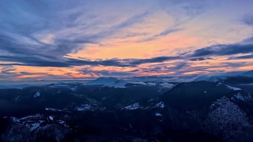 Sunset Over Snowy Mountain Range