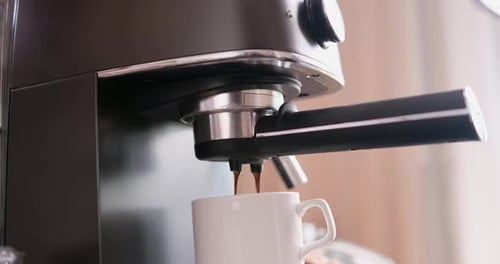 HomeEspresso Making Pouring Coffee Stream From Machine Into Cup