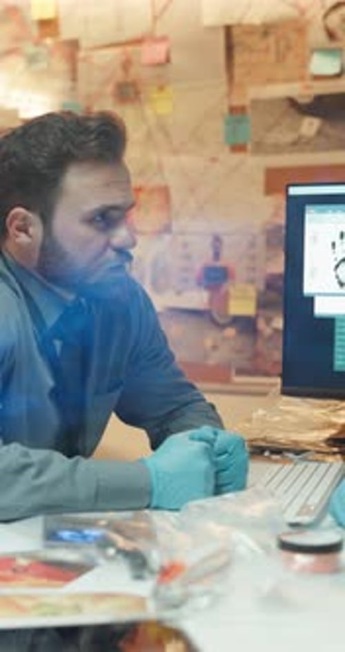 Discussion, computer and detective or man in police station for investigation