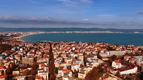 Red-roofed city scenery of the sunny city at the coast of the sea. Aerial view on Nessebar