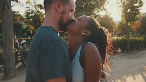 Loving Couple Embrace in Golden Hour Sunlight