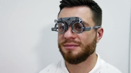 Man Wearing Trial Frame for Eye Exam