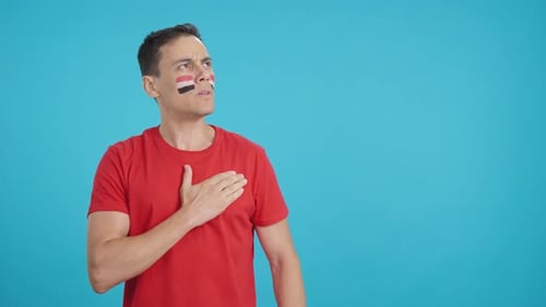 Man Listening to the Egypt National Anthem with Solemnity