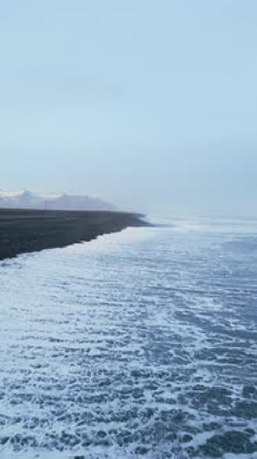 Vertical Video Aerial View of Arctic Black Sand Beach