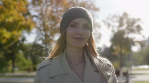 Attractive Woman in Park Posing in Autumn