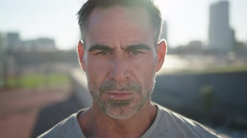 Adult Man Runner and Breathing for Fitness Wellness and Resting After Outdoor Cardio Workout in City